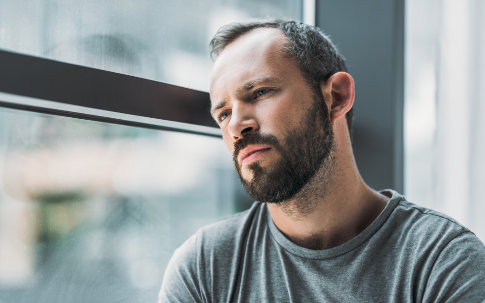 Pensive man facing South Australian Claim Denials