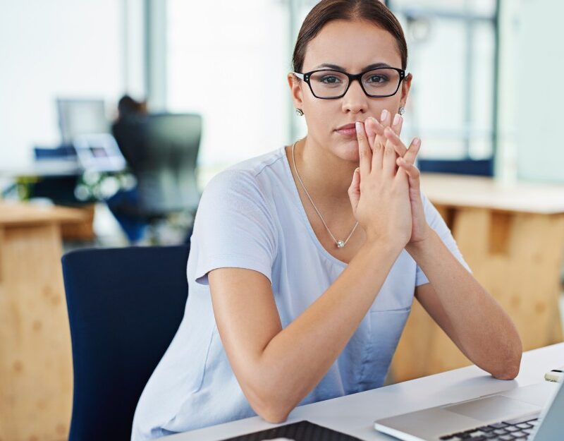 Woman in the office suffering from workplace bullying in NSW