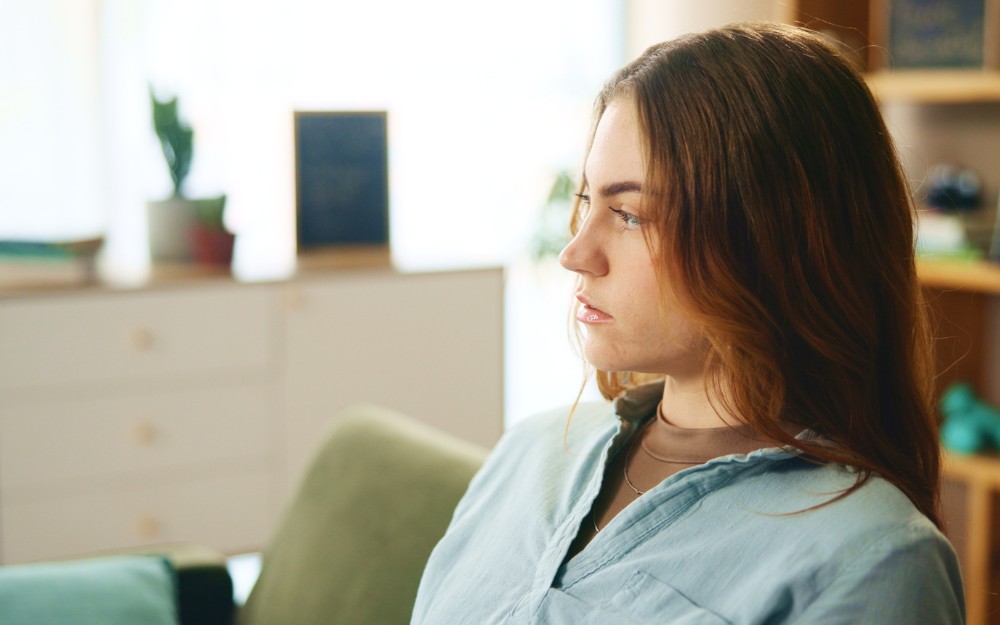 Pensive woman with a mental health condition, eligible for tpd claim for mental illness