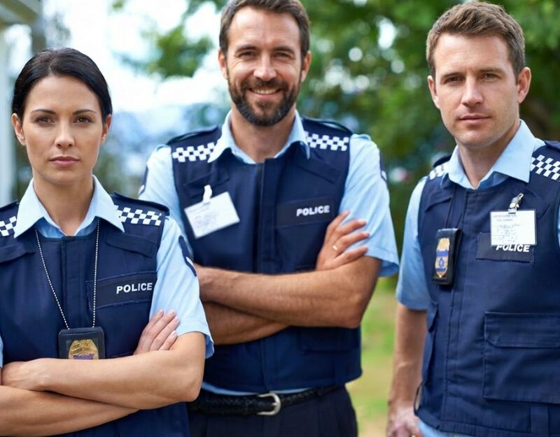 Three police officers standing — emergency service workers compensation
