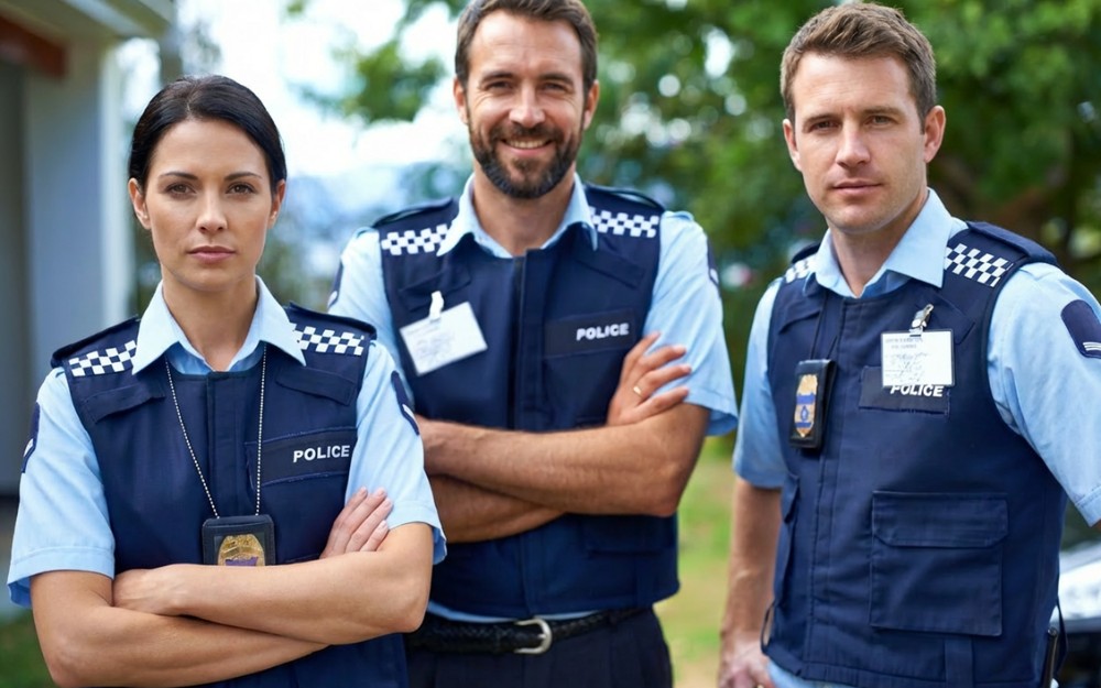 Three police officers standing — emergency service workers compensation